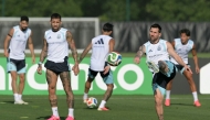 Argentina’s Lionel Messi (right) takes part in a training session with teammates. (AFP)