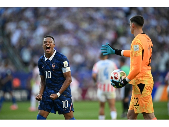 France's forward #10 Kylian Mbappe celebrates past Paraguay's goalkeeper #12 Orlando Gill after winning the 2026 World Cup round of 16 football match between Paraguay and France at the Philadelphia Stadium in Philadelphia on July 4, 2026. (Photo by MAURO PIMENTEL / AFP)