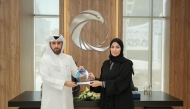 Assistant Director of Cyber Security Policies and Strategies Department at NCSA Dalal Al Aqeedi (right) and Human Resources Director for the Middle East and North Africa at beIN Media Group Hamad Al Sheikh during the signing of the agreement.