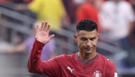 Portugal's forward #07 Cristiano Ronaldo waves to fans after losing the 2026 World Cup round of 16 football match between Portugal and Spain at the Dallas Stadium in Arlington on July 6, 2026. (Photo by Thomas Coex / AFP)