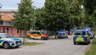 Cars by Police and rescue personnel are parked near the secondary school Schongau, in the southern German state of Bavaria, where several people have been wounded and a suspect arrested in an attack on July 8, 2026.  (Photo by Christoph PETERS / DPA / AFP)