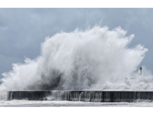 Strong waves break along the coast in Yilan on July 10, 2026, as Typhoon Bavi moves toward Northeastern Taiwan. (Photo by I-Hwa Cheng / AFP)