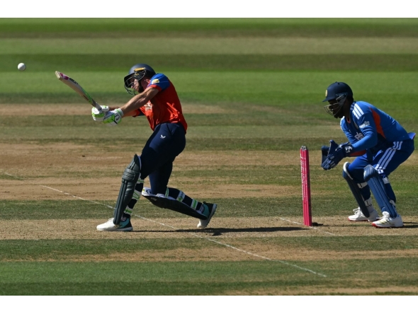 England's Jos Buttler hits a boundary as India's Sanju Samson keeps wicket during the fifth Twenty20 (T20) International cricket match between England and India at Utilita Bowl in Southampton on July 11, 2026. (Photo by JUSTIN TALLIS / AFP)
