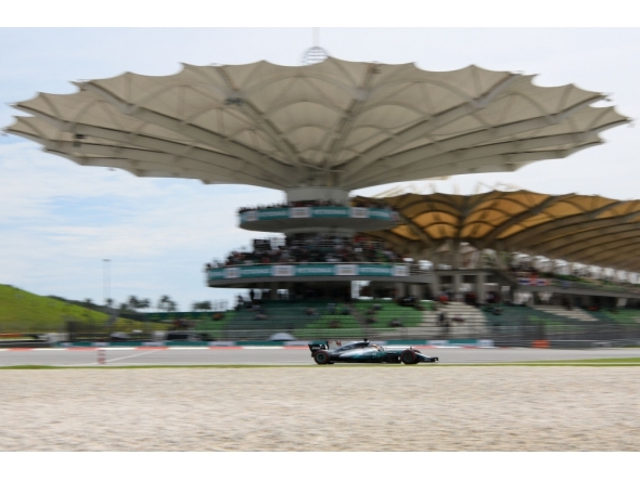 (Files) Then Mercedes's British driver Lewis Hamilton drives his car during the third practice session of the Formula One Malaysia Grand Prix in Sepang on September 30, 2017. (Photo by Manan Vatsyayana / AFP)