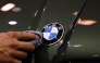 (Files) A staff member cleans the car logo of a BMW at the International Motor Show IAA on September 8, 2025, in Munich, southern Germany. (Photo by Alexandra Beier / AFP)
 