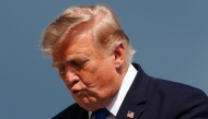 US President Donald Trump gestures while stepping off Air Force One upon arrival at Morristown Municipal Airport in Morristown, New Jersey, on July 31, 2026. (Photo by Aaron Schwartz / AFP)
 
