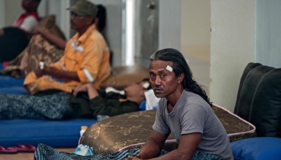 Survivors of the ferry fire recover at Tanjung Perak port in Surabaya on August 3, 2026, a day after the disaster that killed at least five people and prompted many to jump from the vessel into the sea. (Photo by JUNI KRISWANTO / AFP)