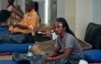 Survivors of the ferry fire recover at Tanjung Perak port in Surabaya on August 3, 2026, a day after the disaster that killed at least five people and prompted many to jump from the vessel into the sea. (Photo by JUNI KRISWANTO / AFP)
