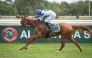 Jockey Alexandre Gavilan guides Fakhira towards the finish line. 