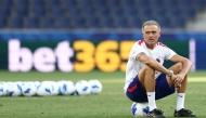 Paris Saint-Germain's Spanish coach Luis Enrique sits on a ball as he oversees a training session of his players on August 11, 2026, the eve of the UEFA Supercup football match between Champions League winners Paris Saint Germain (PSG) and Europa League winners Aston Villa in Salzburg, Austria. (Photo by FRANCK FIFE / AFP)