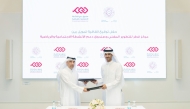Executive Director of QCDC, Saad Abdulla Al-Kharji (right) and Director of Programmes at DAAM, Hassan Yousef Al Obaidly during the agreement signing ceremony.  