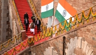 India's Prime Minister Narendra Modi (C, front) leaves after addressing the nation from the ramparts of the Red Fort during the celebrations to mark the country's Independence Day in New Delhi on August 15, 2026. (Photo by Sajjad HUSSAIN / AFP)