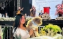 Jessica Florez, sister-in-law of the Colombian lawyer Lenny Ruiz, who died protecting her dog Salomon, during the August 10th earthquake in Cali, holds Solomon during Ruiz's funeral in Pasto, Colombia on August 13, 2026. (Photo by Eyder Portilla / AFP)