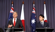 Japan's Defence Minister Shinjiro Koizumi (R) stands with Australian Deputy Prime Minister and Defence Minister Richard Marles (L) during a press conference at Parliament House in Canberra on August 18, 2026. (Photo by HILARY WARDAUGH / AFP)