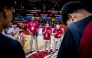 Qatar coach Mounir Ben Zeghala (second right) speaks to players.