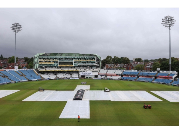 The covers stay on the pitch as rain delays the start of day two of the first Test match between England and Pakistan at Headingley cricket ground in Leeds, northern England on August 20, 2026. (Photo by Darren Staples / AFP) 