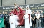 Qatar Table Tennis Association officials pose for photos with victorious Team Qatar players. 