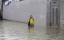 A student stands in floodwater in Quezon City, the Philippines, on Aug. 17, 2026. (Xinhua/Rouelle Umali)