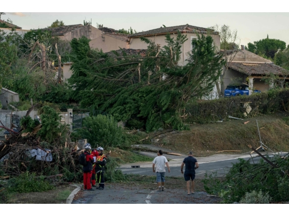 This photograph taken on August 24, 2026, shows damaged houses and toppled trees after a tornado struck Pomas, southwestern France. (Photo by Idriss Bigou-Gilles / AFP)