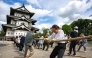 Participants pull Hirosaki Castle using ropes to its original position following repair works in Hirosaki, Aomori Prefecture on August 26, 2026. (Photo by Philip FONG / AFP)