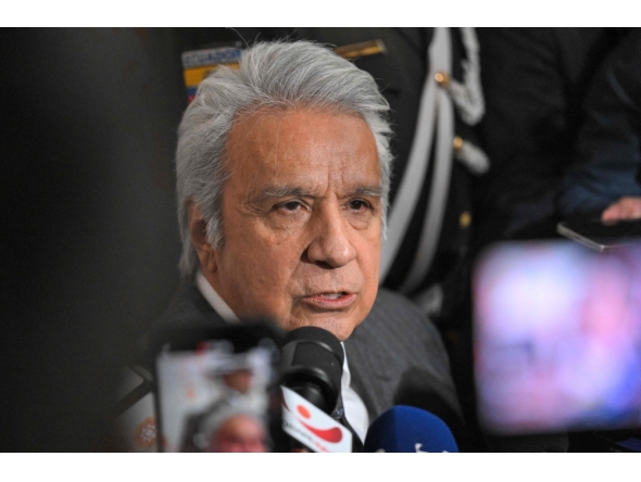(FILES) Ecuador's former president (2017–2021) Lenin Moreno speaks with the media as he leaves the National Court of Justice over a corruption case in Quito, on May 11, 2026.  (Photo by Rodrigo BUENDIA / AFP)