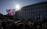 A participant waves an Icelandic flag during a rally of supporters of the 'No' campaign against reopening Iceland's European Union accession negotiations in Reykjavik, Iceland, on August 27, 2026, two days ahead of a national referendum. Icelanders will vote on August 29 on whether the country should resume EU accession negotiations, which were suspended in 2013. (Photo by Jonathan NACKSTRAND / AFP)