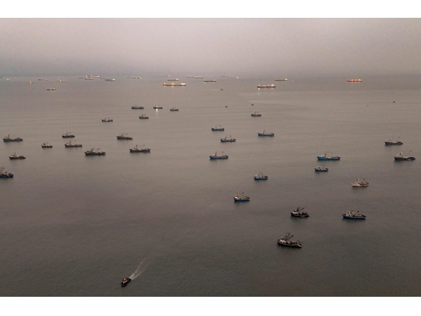 Aerial view shows anchovy fishing boats anchored off the coast in front of the Constitutional Province of Callao, Peru on August 31, 2026. (Photo by Ernesto BENAVIDES / AFP)
 