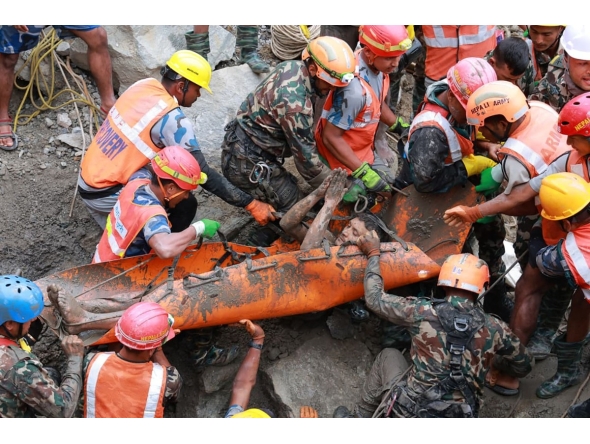 This handout photograph taken and released by the Nepal Army on September 4, 2026 shows army personnel carrying a worker who was trapped inside a tunnel, during a rescue operation at Trishuli-3A Hydropower Project in Nepal's Rasuwa district. Photo by Handout / NEPAL ARMY / AFP
