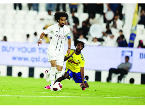 Al Sadd's Akram Afif (left) controls the ball.