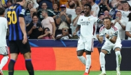 Real Madrid's French forward #10 Kylian Mbappe (R) celebrates scoring his team's first goal with teammate Real Madrid's Brazilian forward #07 Vinicius Junior during the UEFA Champions League first round day 1 football match between Real Madrid and Inter Milan at the Santiago Bernabeu stadium in Madrid on September 8, 2026. (Photo by Thomas COEX / AFP)