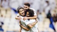 FROM LEFT: Al Sadd's Roberto Firmino, Hashem Ali and Akram Afif celebrate a goal.