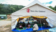 Children, separated from their parents from the flash floods, study at a temporary learning centre run by Save the Children charity in Nepal's Nuwakot district on September 11, 2026. (Photo by Prakash Mathema / AFP) 