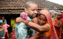 Nepali hydropower worker Sanjay Sah (L) breaks down after meeting his mother at his residence in Nepal's Saptari district on September 13, 2026 after being rescued. (Photo by Deepesh Deo Joshi / AFP)