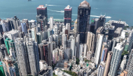 An aerial view shows high-rise buildings in the Central district of Hong Kong on September 16, 2026. (Photo by Peter Parks / AFP)