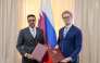 President of GTA Khalifa bin Jassim Al Jaham Al-Kuwari with Commissioner of Federal Tax Service Daniil Egorov.