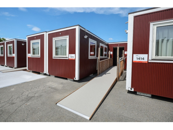 This picture taken on August 26, 2026 and released on September 18, 2026, shows temporary container huts being used to house athletes for the 2026 Asian Games at the Garden Pier in Nagoya. (Photo by JIJI Press / AFP) 