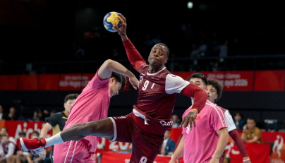 Action during the men's handball match between Qatar and China.