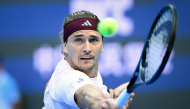 Germany's Alexander Zverev hits a return to Britain's Cameron Norrie during their men's singles first round tennis match at the China Open tennis tournament in Beijing on October 1, 2026. (Photo by WANG Zhao / AFP)