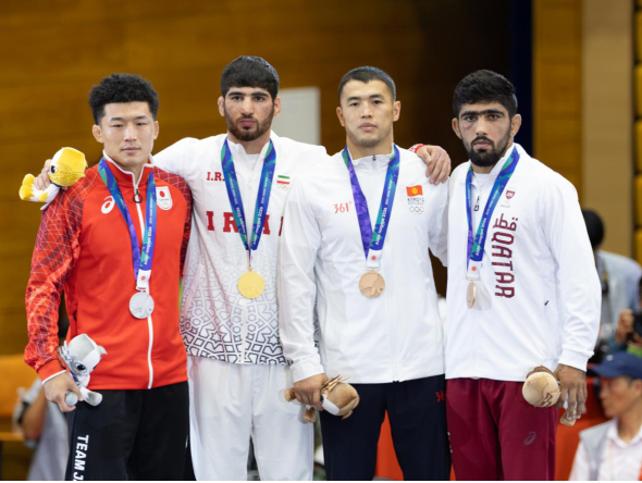 FROM LEFT: Japan’s Nao Kusaka (silver), Iran’s Alireza Abdevali (gold), and bronze winners Akzhol Makhmudov of Kyrgyzstan’s and Qatar’s Shahin Mohammed on the podium.