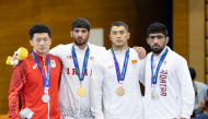 FROM LEFT: Japan’s Nao Kusaka (silver), Iran’s Alireza Abdevali (gold), and bronze winners Akzhol Makhmudov of Kyrgyzstan’s and Qatar’s Shahin Mohammed on the podium.