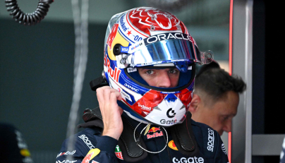 Red Bull Racing's Dutch driver Max Verstappen wears his helmet ahead of the second practice session ahead of the Formula One Bahrain Grand Prix in Sepang on October 2, 2026. (Photo by Jade Gao / AFP)