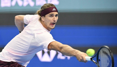 Germany Alexander Zverev hits a return to China Shang Juncheng during their men singles match at the China Open tennis tournament in Beijing on October 3, 2026. (Photo by GREG BAKER / AFP)