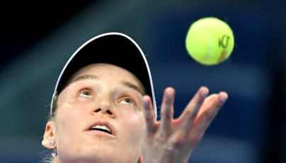 :Kazakhstan Elena Rybakina serves to Armenia Alina Charaeva during their women singles match at the China Open tennis tournament in Beijing on October 3, 2026. (Photo by GREG BAKER / AFP)