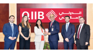 QIIB COO Mohammed Khair Barhoumeh receiving the award from Citibank Head of Financial Institutions Sales for the Middle East Seemanti Considine in presence of other officials.