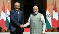India's Prime Minister Narendra Modi (R) and Switzerland's President Guy Parmelin shake hands before their meeting at the Hyderabad House in New Delhi on October 5, 2026. (Photo by Sajjad HUSSAIN / AFP)