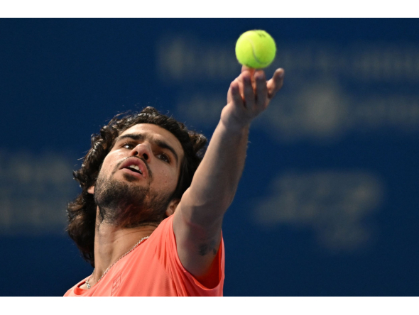 Spain's Carlos Alcaraz serves to compatriot Jaume Munar in their men's singles semi-final tennis match at the ATP Tour Japan Open Tennis Championships at the Ariake Tennis Forest Park in Tokyo on October 5, 2026. (Photo by Rie KIKUCHI / AFP)