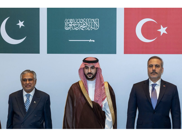 This handout photograph taken and released by the Turkish Foreign Ministry on October 5, 2026 shows (L-R) Pakistan's Deputy Prime Minister and Minister for Foreign Affairs Ishaq Dar, Saudi Defence Minister Prince Khalid bin Salman Al Saud and Turkish Foreign Minister Hakan Fidan posing during a meeting of the Strategic Political and Defense Committee, established under the Mecca Joint Defense Agreement, in Riyadh. (Photo by Handout / Turkish Foreign Ministry / AFP)