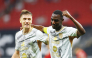 Al Duhail's Krzysztof Piatek (left) and Almoez Ali celebrate.