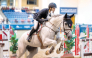 Mohammed Yousef Al Jaber guides Shotgun 7 over a fence.