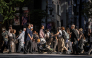 People cross a street in Ginza area of Tokyo on October 8, 2026. (Photo by Yuichi YAMAZAKI / AFP)